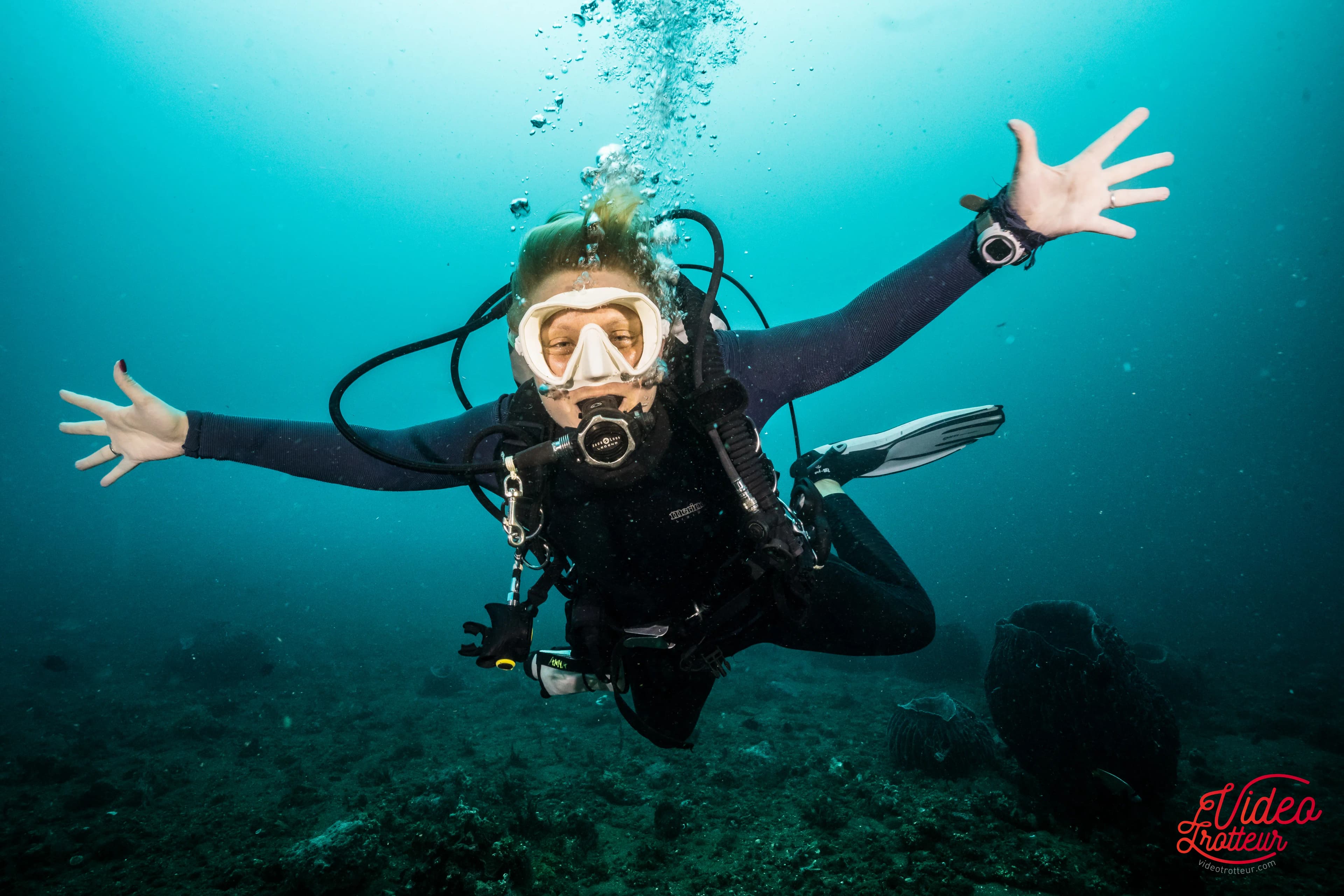 Diver underwater enjoying the diving experience Diver underwater enjoying the diving experience