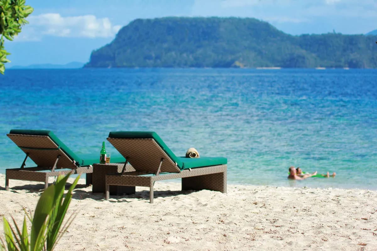 Two sun beds on the beach Two sun beds on the beach