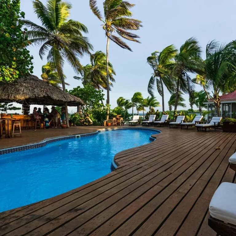 Swimming pool and deck at the Belize luxury dive resort Turneffe Island Resort Swimming pool and deck at the Belize luxury dive resort Turneffe Island Resort
