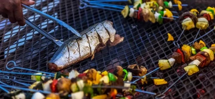 Fish and kebabs on a grill at Turneffe Island Resort Fish and kebabs on a grill at Turneffe Island Resort
